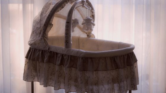 Pink frilly bassinet