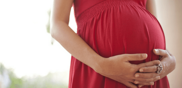 Pregnant Woman Holding Tummy