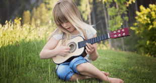 Little Girl Playing Guitar