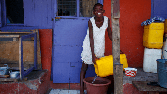 African Girl pouring Water