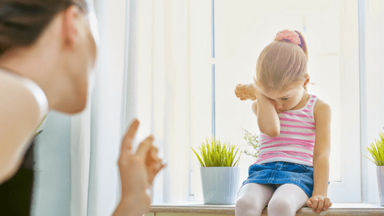 Mother scolding child