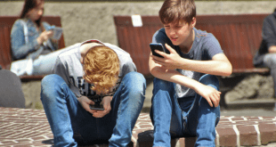 Teenage boys on phones