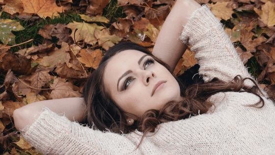 Beautiful woman lying on grass