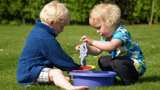 Children playing with cloths