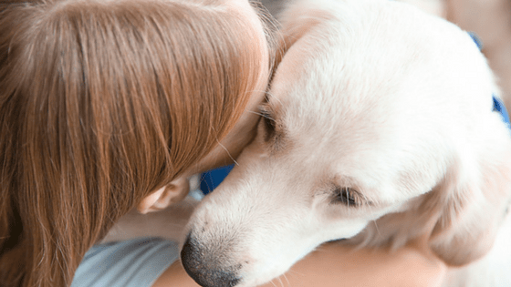 Girl Hugging Dog