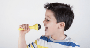 Little Boy Singing With Microphone