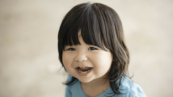 Toddler girl smiling