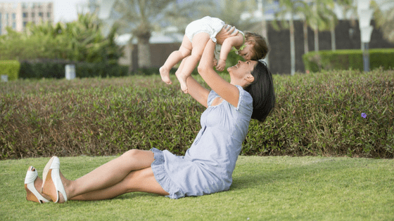 Mommy and baby playing outside