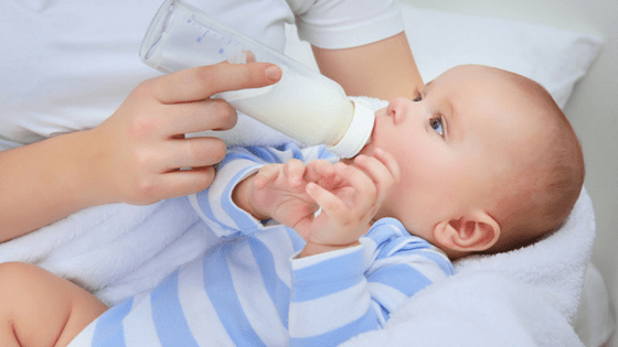 Young baby drinking milk