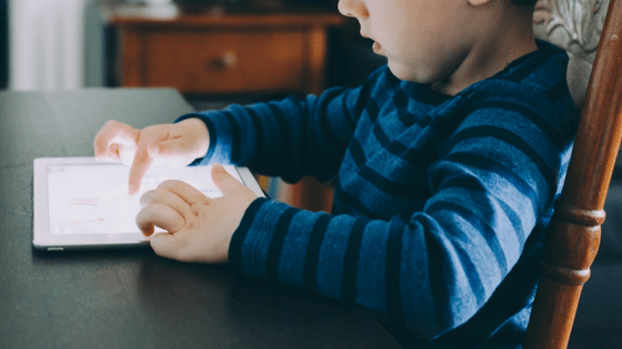 Boy learning on tablet