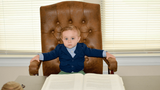 Toddler boy in office chair