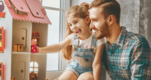 Happy Girl Playing With Doll house