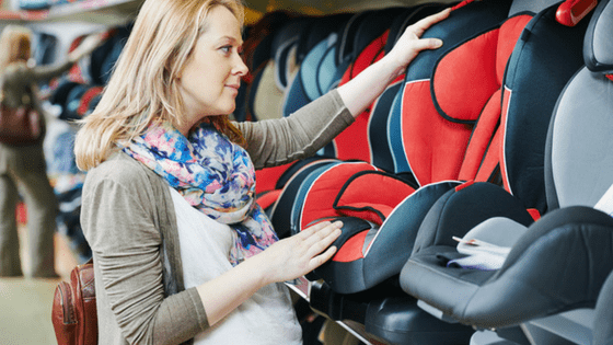 Mother to be choosing baby car seat