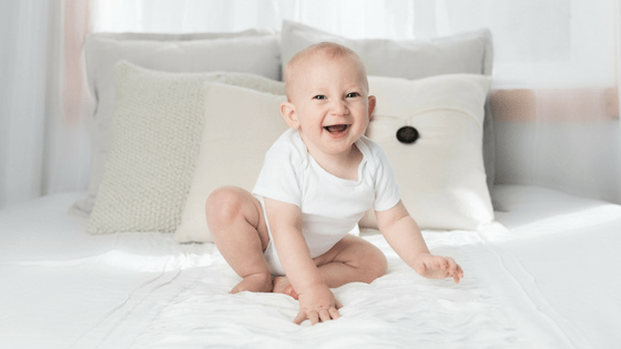baby laughing bed