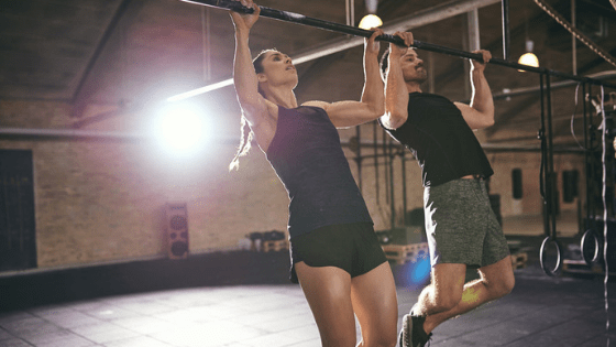 Man and Women doing pull ups