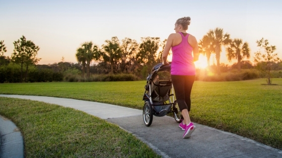 Mom running with baby in jogging stroller