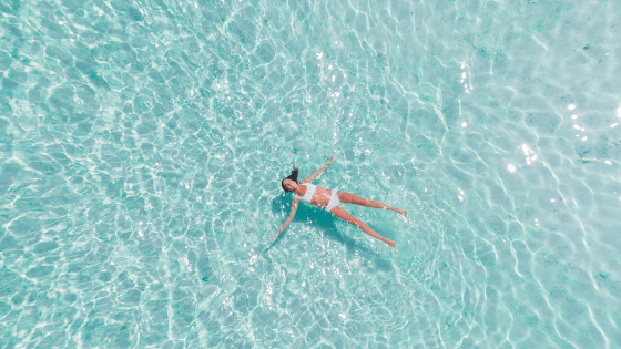 Woman floating in pool