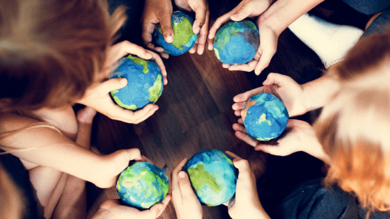 Children holding the earth