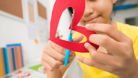 Kids Activity cutting out paper heart