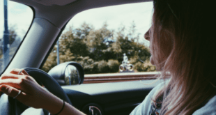 Teenage girl driving car