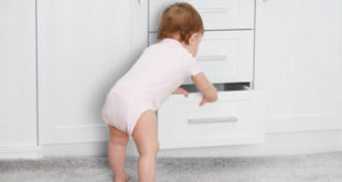 Baby looking in drawer