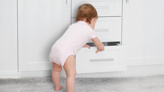 Baby looking in drawer