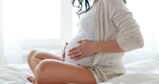 Pregnant woman in white