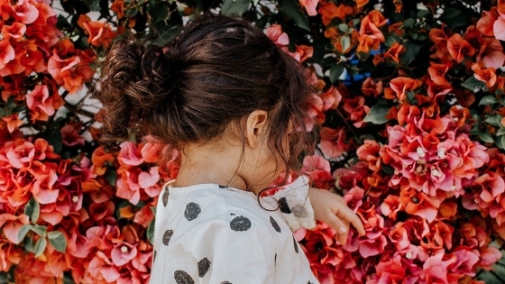 Girl looking at flowers