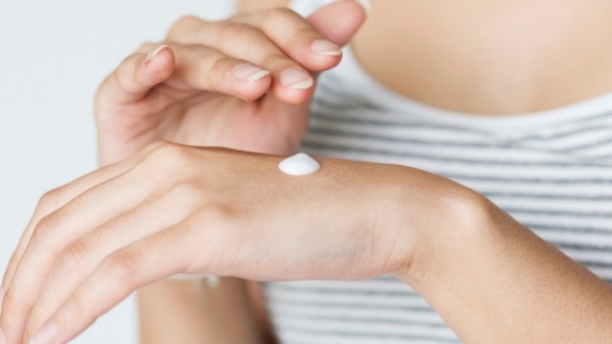 Woman Putting Cream On