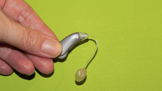 Holding hearing aid
