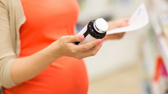 Pregnant woman checking labels