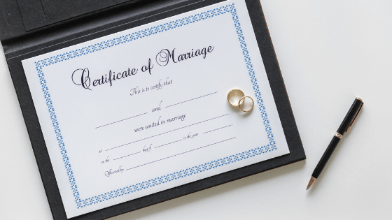 Marriage certificate and pen