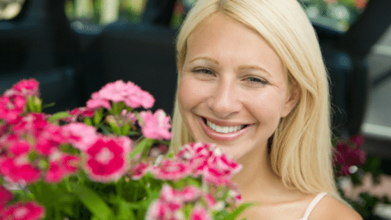 Smiling woman with flowers