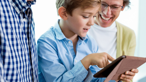 Kid showing parents tablet