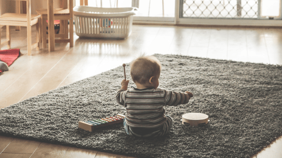 Toddler playing music