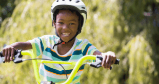 Happy child cycling