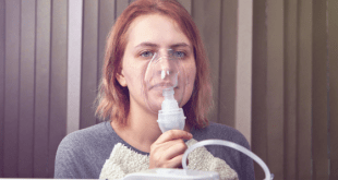 Woman nebulizing