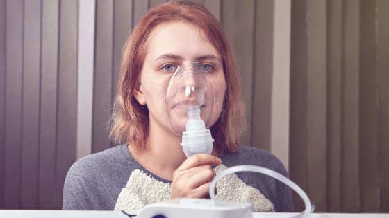 Woman nebulizing