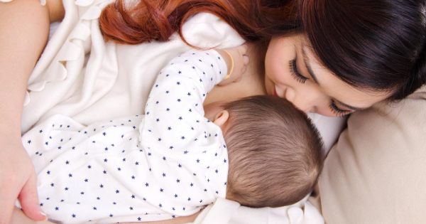 Dark haired mom nursing baby