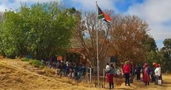 School kids hoisting SA flag