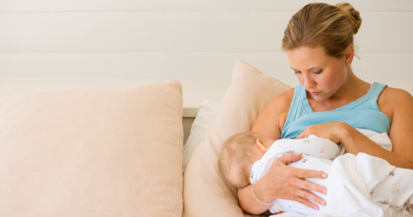 Mother Watching Nursing Baby