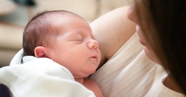 Newborn with eyes closed