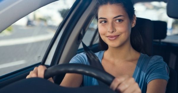 Happy woman driving