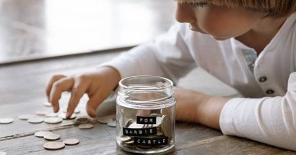 Boy counting and saving money