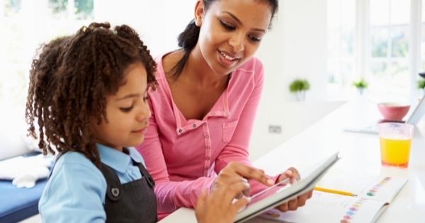 Mother daughter on tablet together