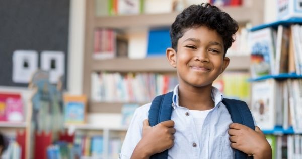 Boy in school library