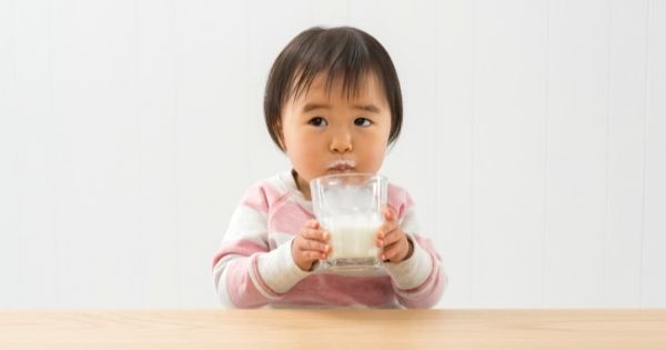 Toddler drinking milk