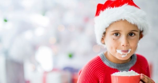 Christmas kid drinking hot chocolate