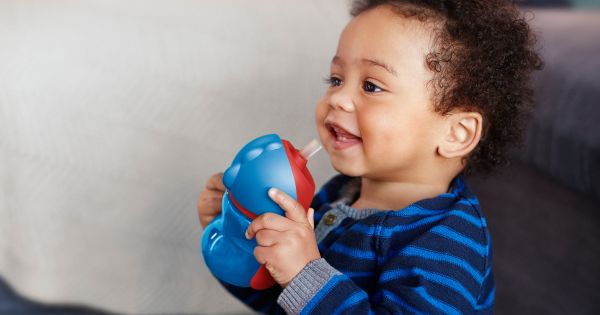 Toddler drinking sippy cup