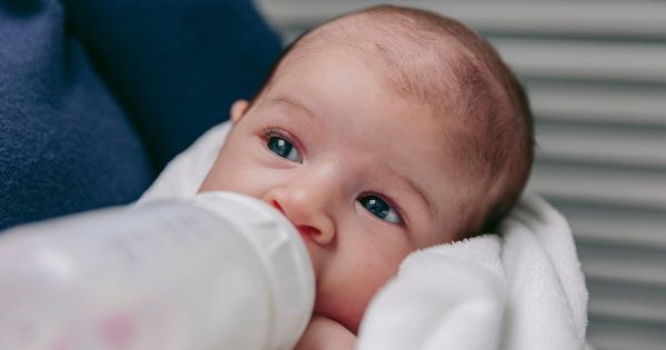 Baby drinking bottle of milk